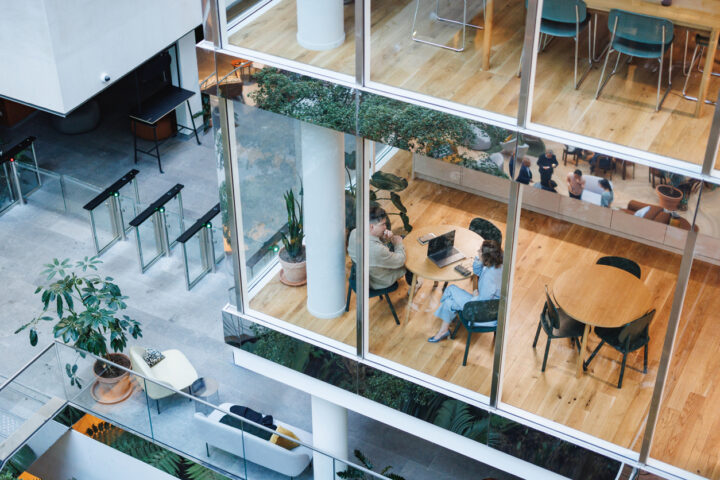 Diverse Business Leaders in a Modern Office Cafe